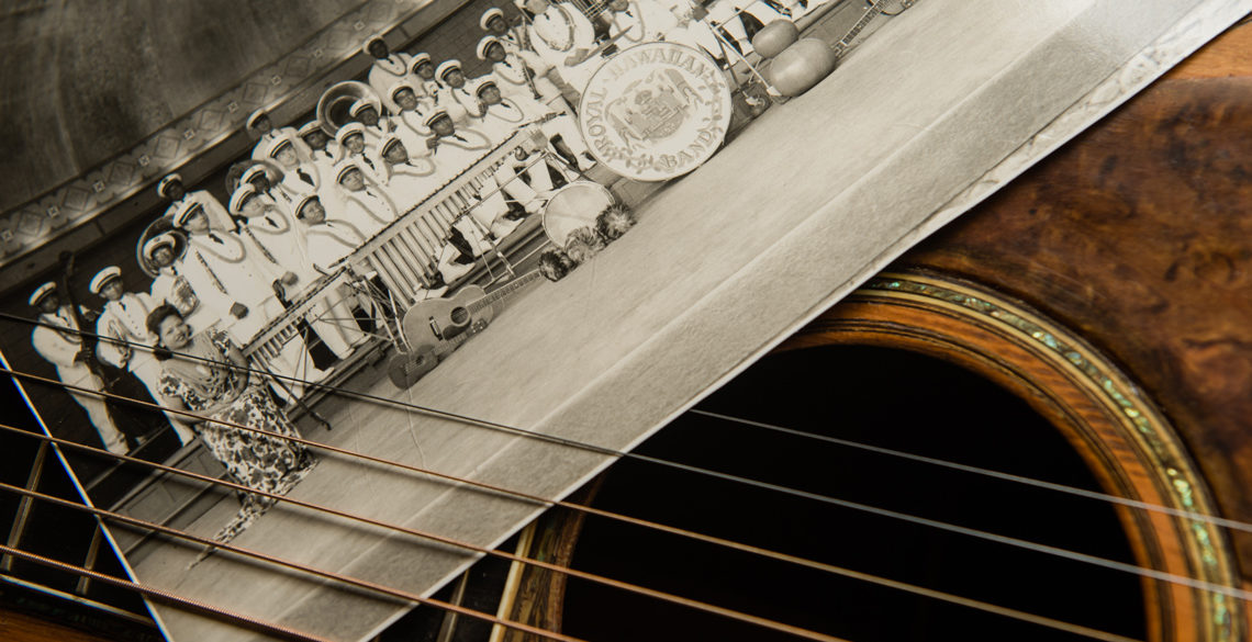 detail on guitar strings with historic hawaii photo