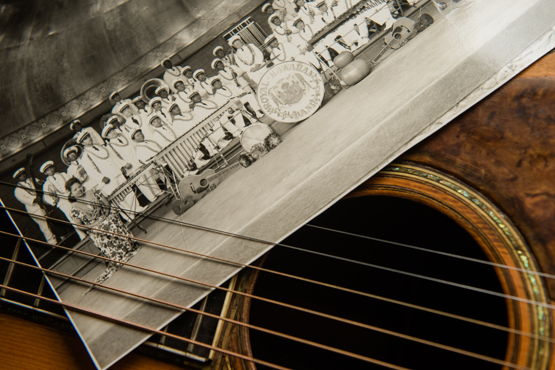 detail on guitar strings with historic hawaii photo