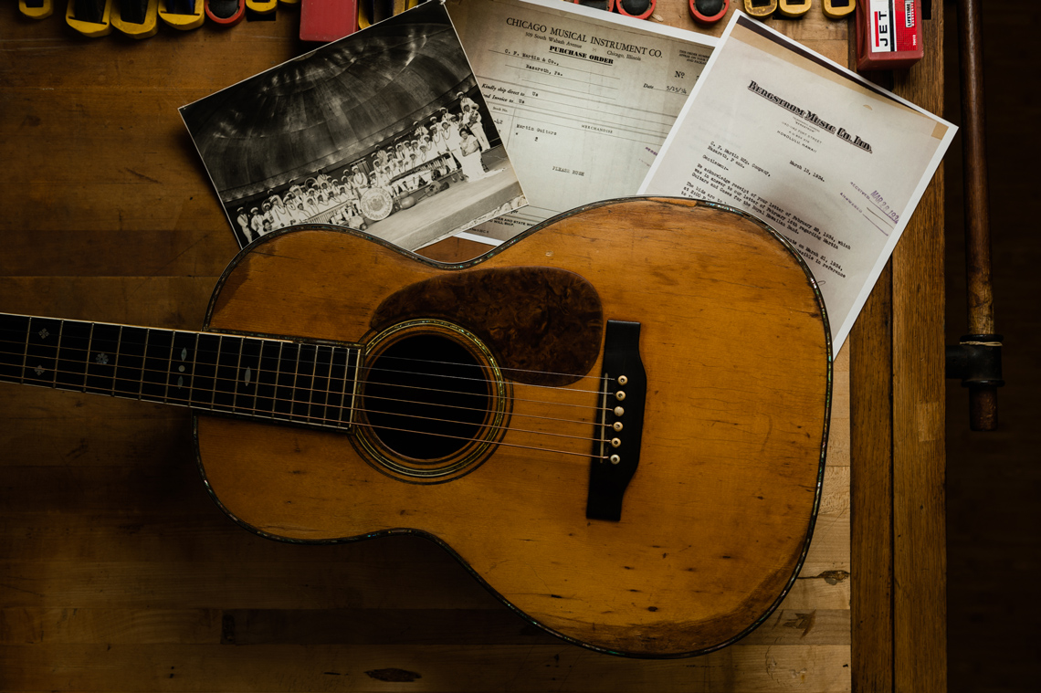 vintage guitar with historic documents