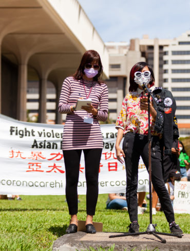 Two demonstrators at the Stop Asian Hate rally in Honolulu