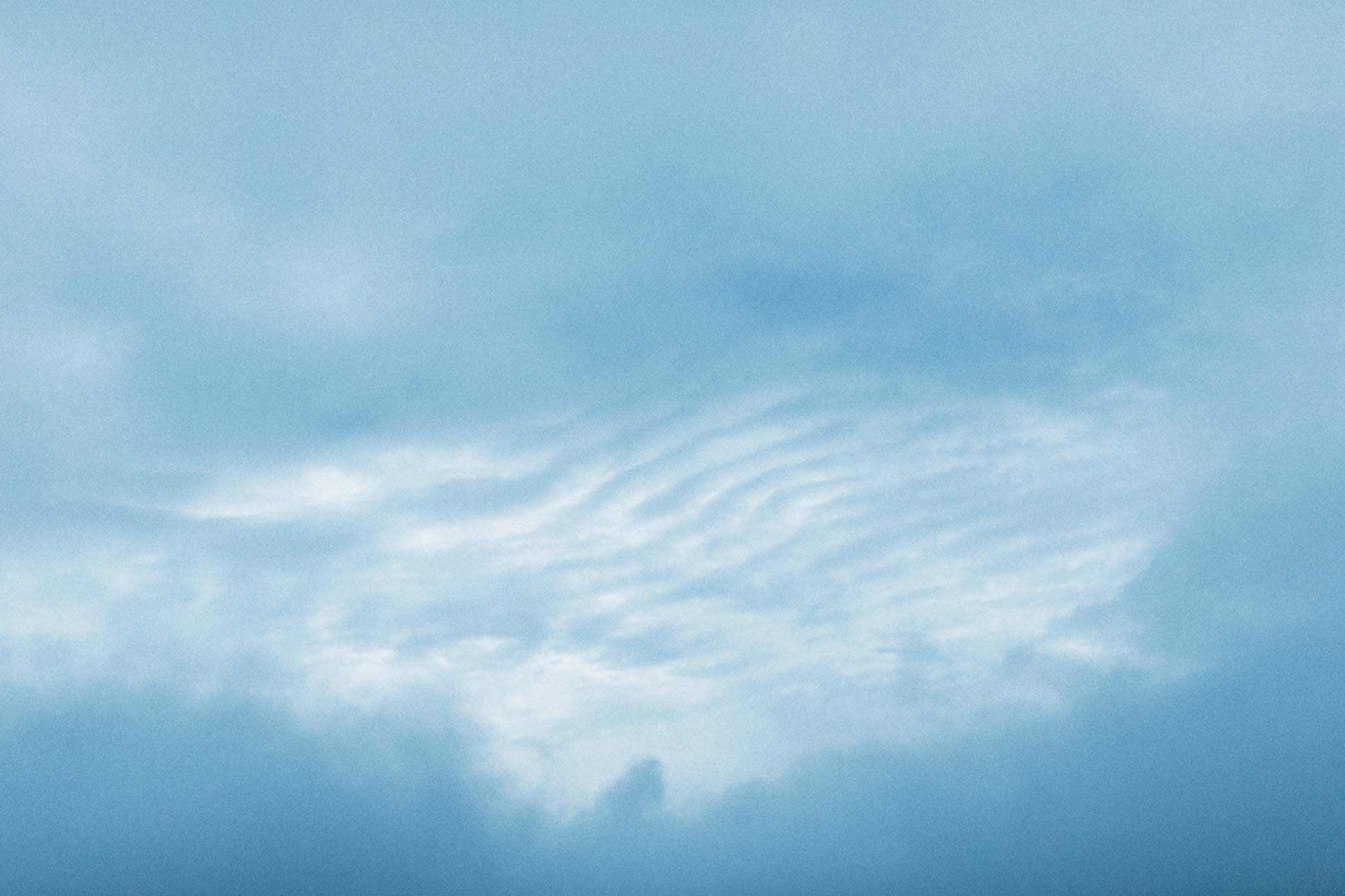 a blue sky with wispy clouds 