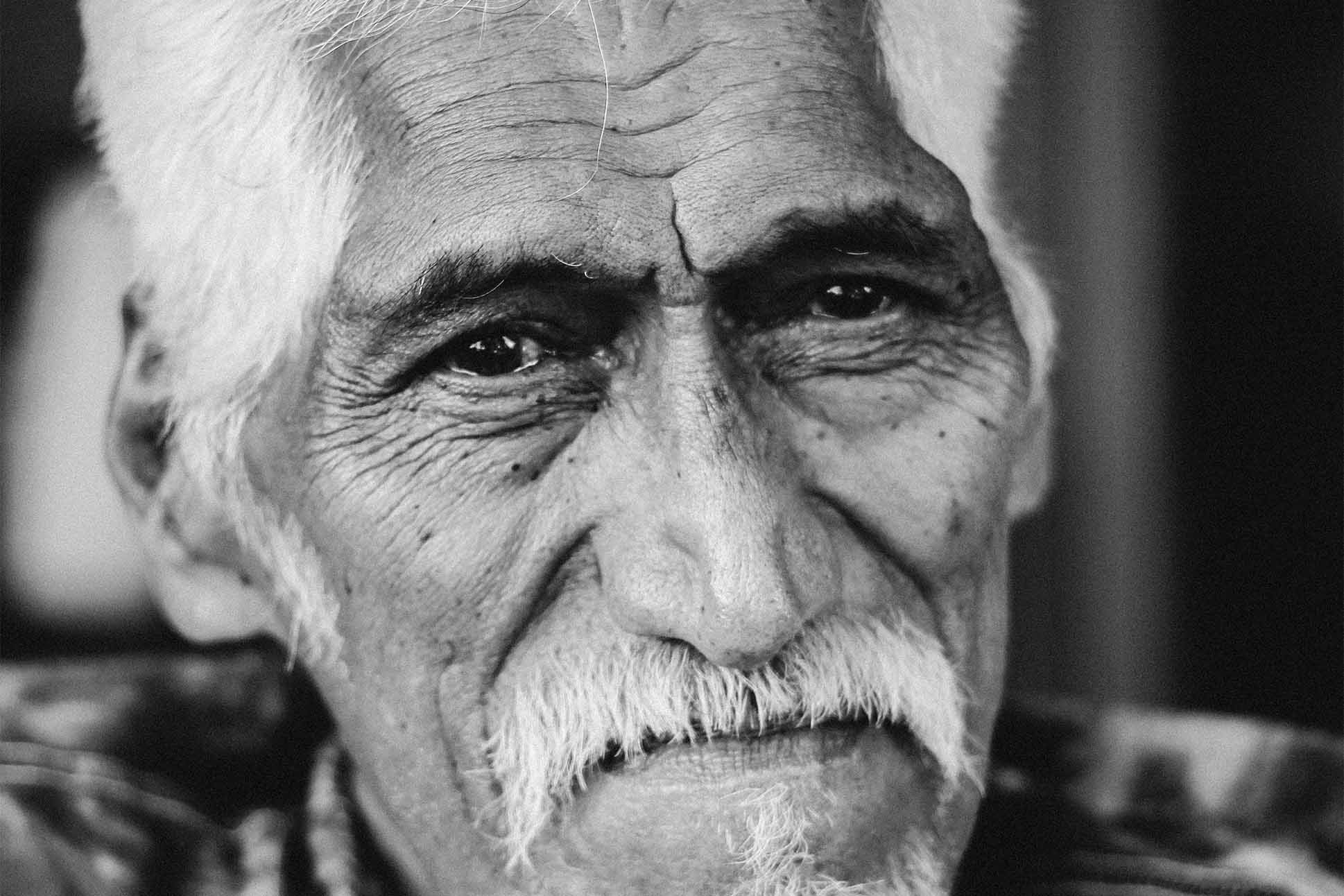 a close-up of a person with a mustache, a photo by Nani Welch Keli‘iho‘omalu