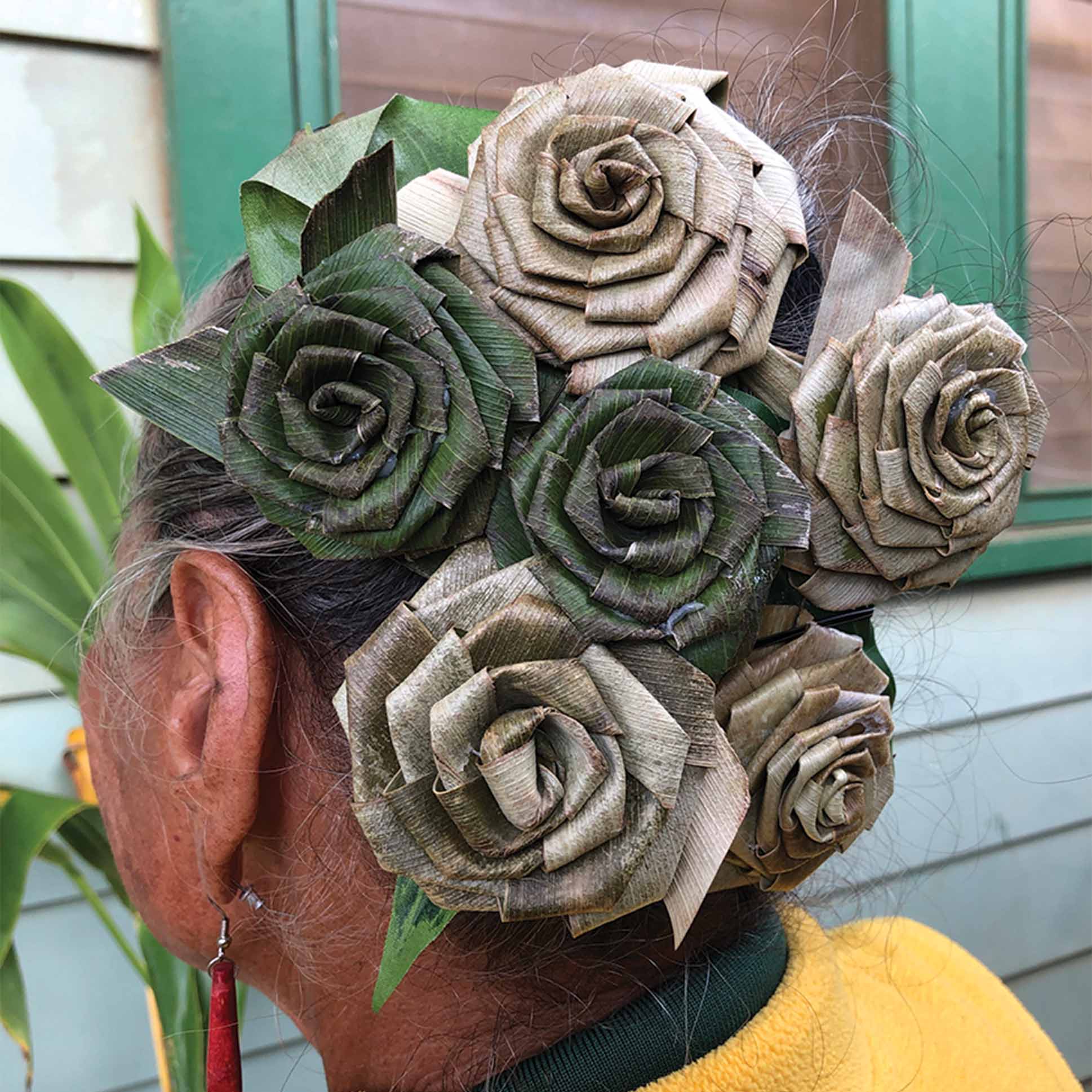 a person with a floral headpiece