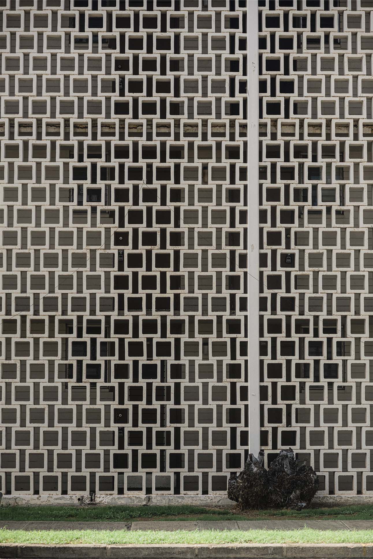 a white and black square pattern on a wall