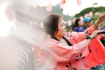 a person in a pink robe holding a sword