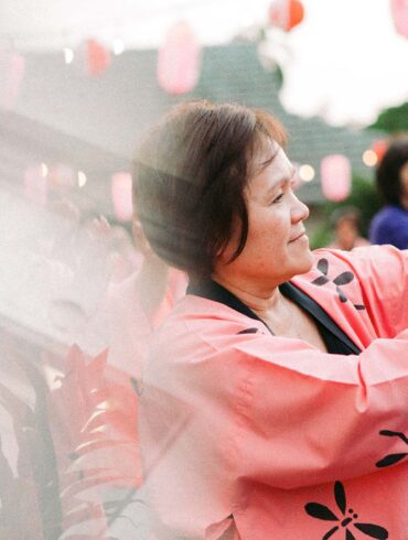 a person in a pink robe holding a sword