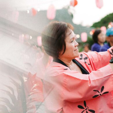 a person in a pink robe holding a sword